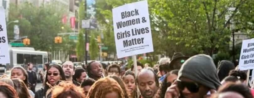 Protestors holding sign that says Black Women and Girls Lives Matter
