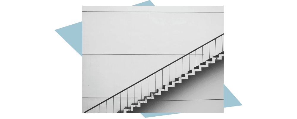 staircase against gray wall